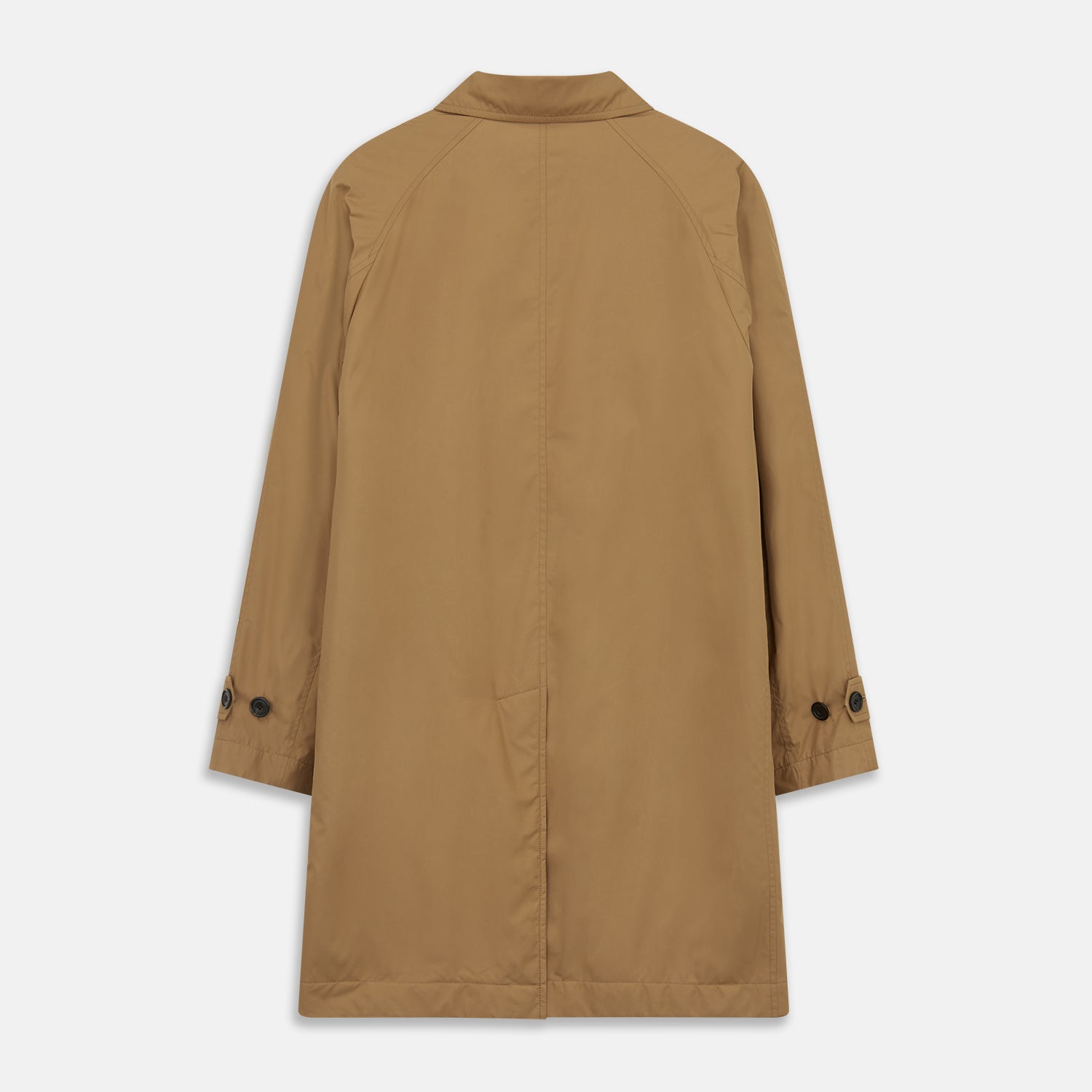 View 10 of product A person wears the Turnbull & Asser Camel Quintern Sealup Raincoat with Detachable Liner, paired with dark pants, standing against a plain light gray background, showing the sleek technical rainwear style with one hand in a pocket.