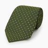 View 6 of product The Turnbull & Asser Green and Blue Micro Dot Silk Tie is shown rolled up, displaying small light blue dots on green silk against a plain white background.