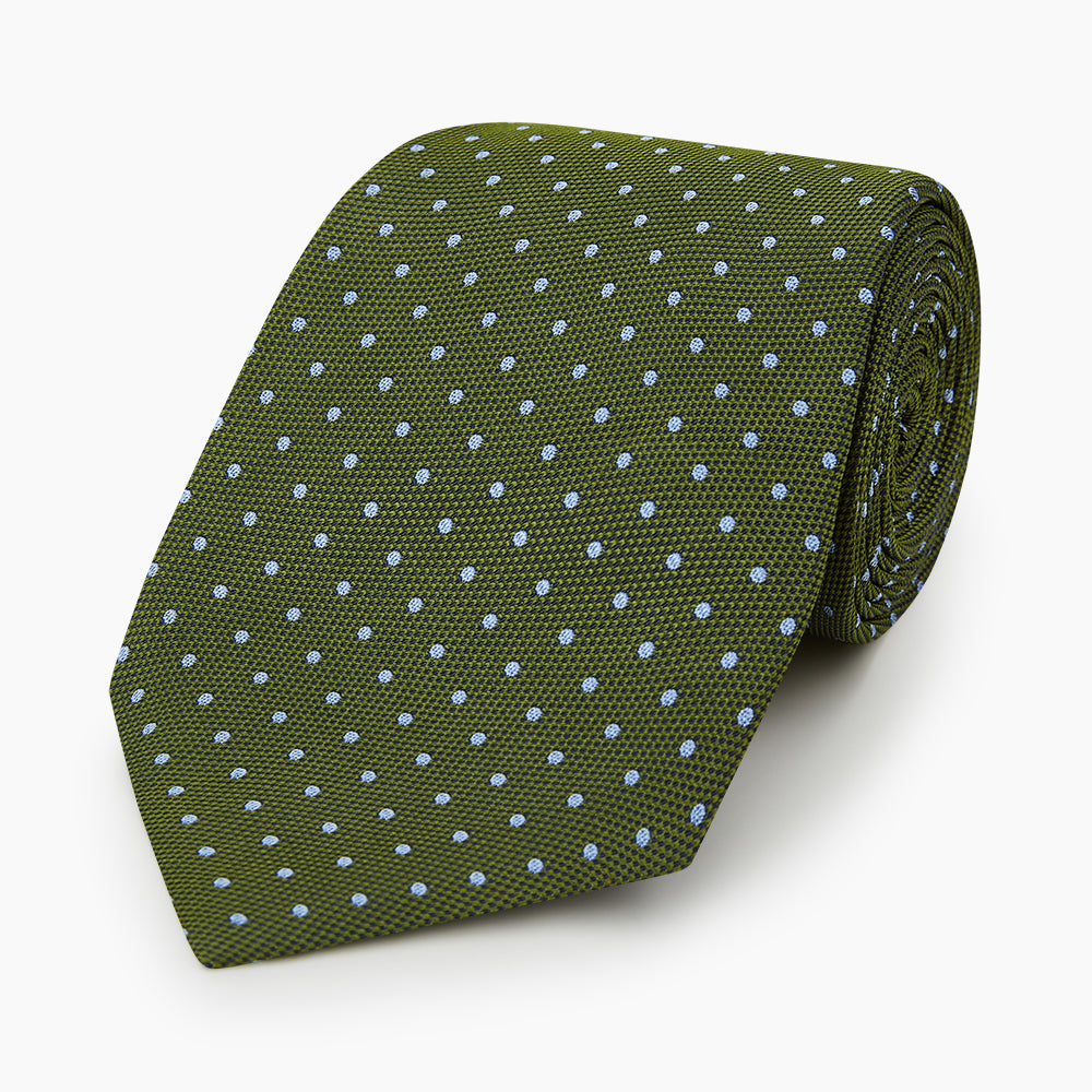 The Turnbull & Asser Green and Blue Micro Dot Silk Tie is shown rolled up, displaying small light blue dots on green silk against a plain white background.