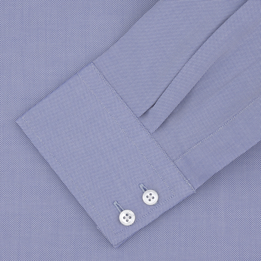 A Turnbull & Asser Tailored Fit Blue Royal Oxford Cotton Shirt with a Kent collar and 2-button cuffs is neatly displayed on a white background, highlighting its refined design and quality craftsmanship.