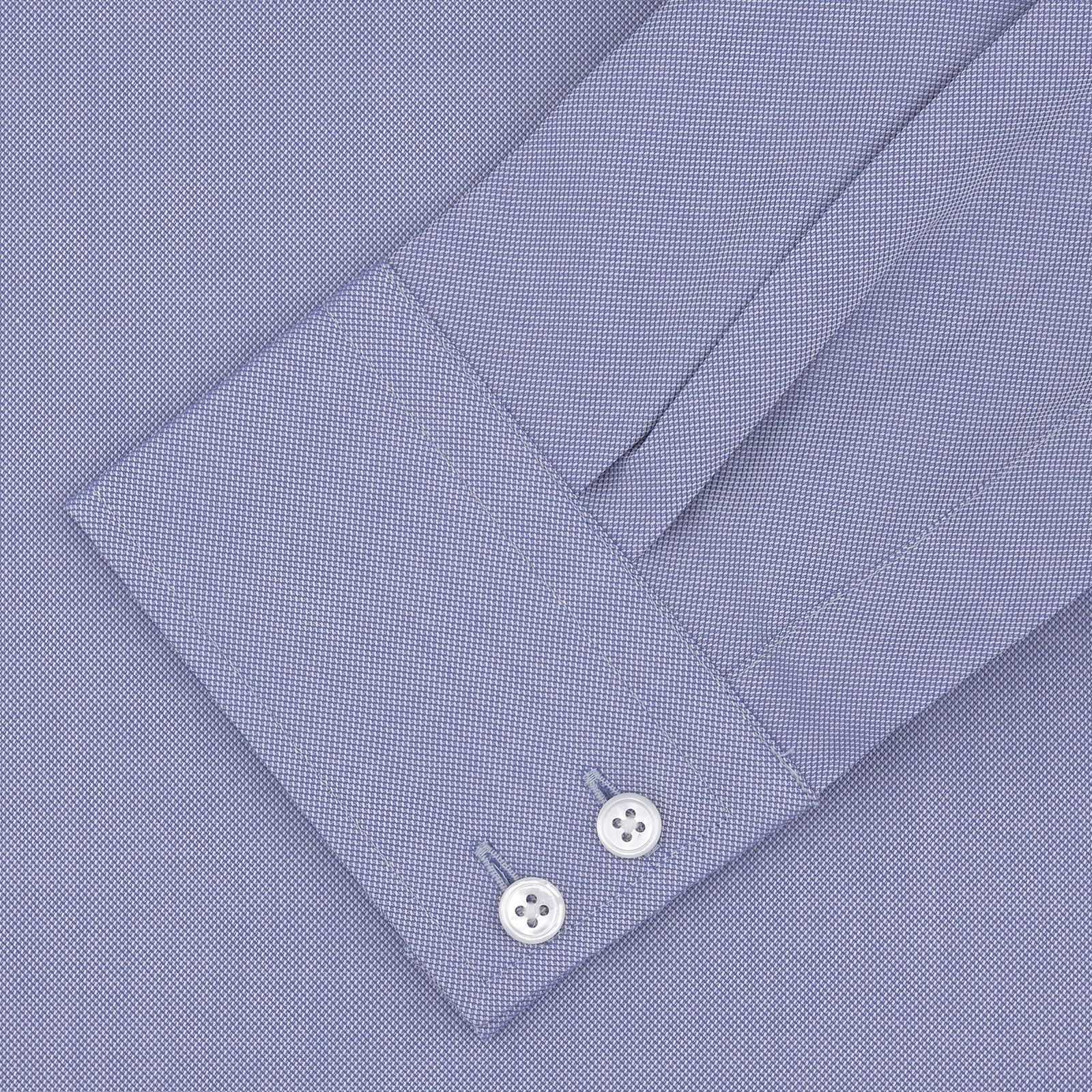 View 4 of product A Turnbull & Asser Tailored Fit Blue Royal Oxford Cotton Shirt with a Kent collar and 2-button cuffs is neatly displayed on a white background, highlighting its refined design and quality craftsmanship.
