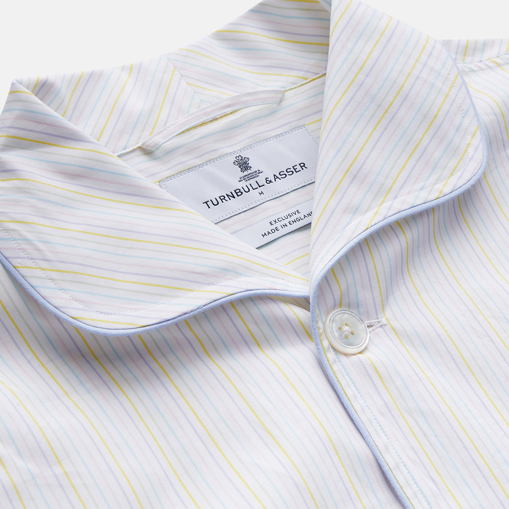 The Yellow Multi Stripe Cotton Quin Pyjama Set by Turnbull & Asser features a striped button-up top with chest pocket and drawstring pants—luxury sleepwear crafted from soft cotton, displayed on a white background.