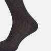 View 4 of product A single Charcoal Mid-Length Sock by Turnbull & Asser, crafted from mercerised Egyptian cotton in dark brown flat-knit, is displayed upright against a plain white background.