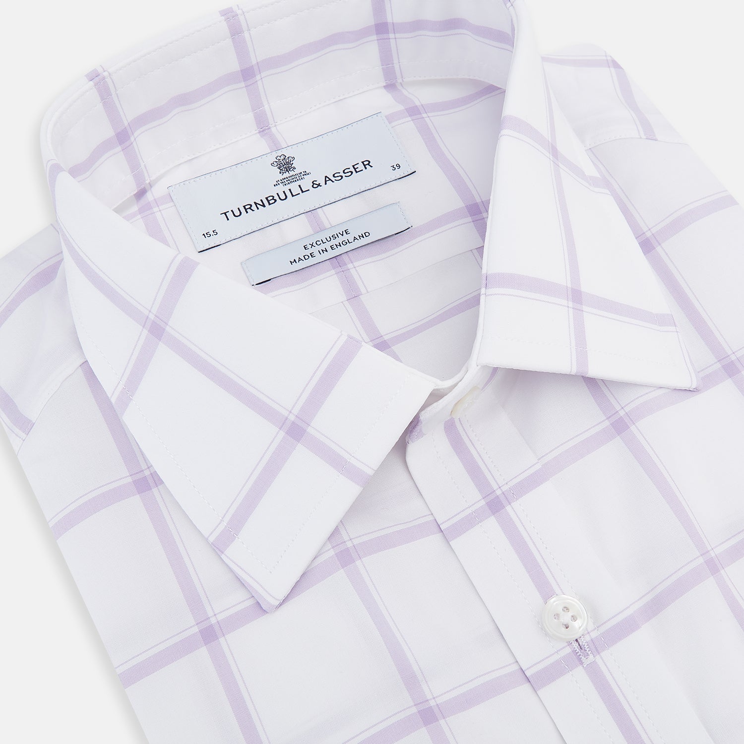 View 2 of product The Turnbull & Asser Lilac Grid Check Mayfair Shirt is a long-sleeve, button-up style crafted from Italian cotton with a white base and lilac grid check pattern, shown on a plain white background.