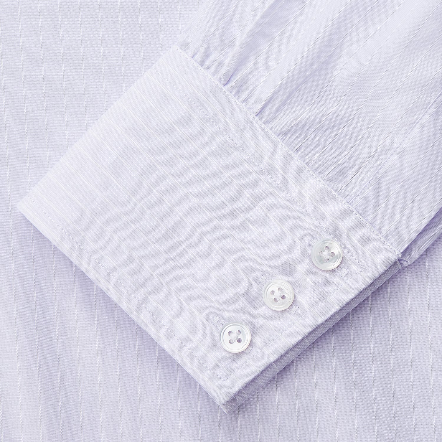 View 3 of product The Turnbull & Asser Soft Lilac Stripe Cotton Regular Fit Mayfair Shirt features a classic collar, cuffed long sleeves, and subtle vertical stripes, shown on a plain white background.