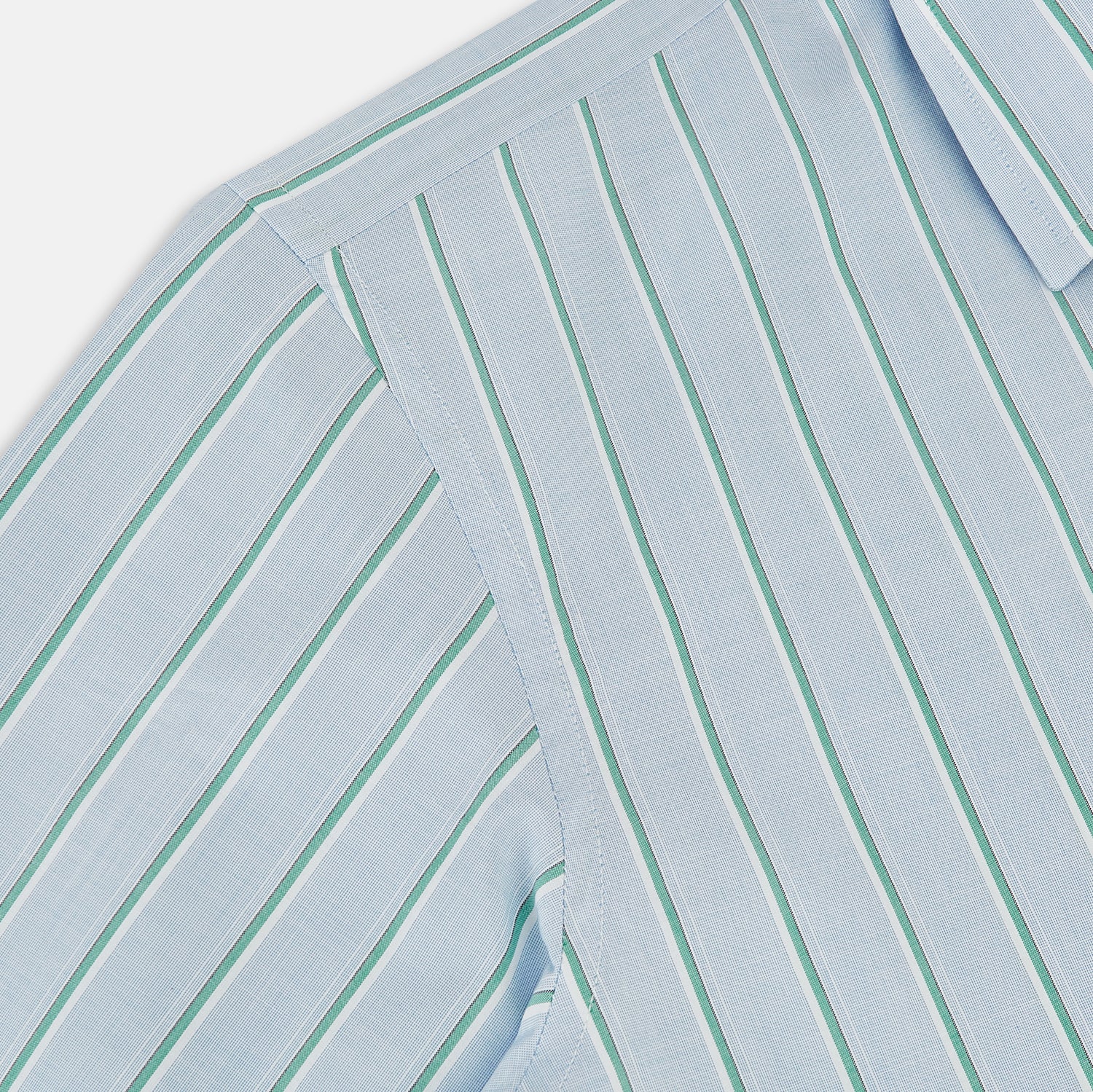 View 6 of product Blue and green multi-stripe Westminster shirt by Turnbull & Asser, featuring a pointed collar and buttoned cuffs—a refined example of British craftsmanship on a plain white background.