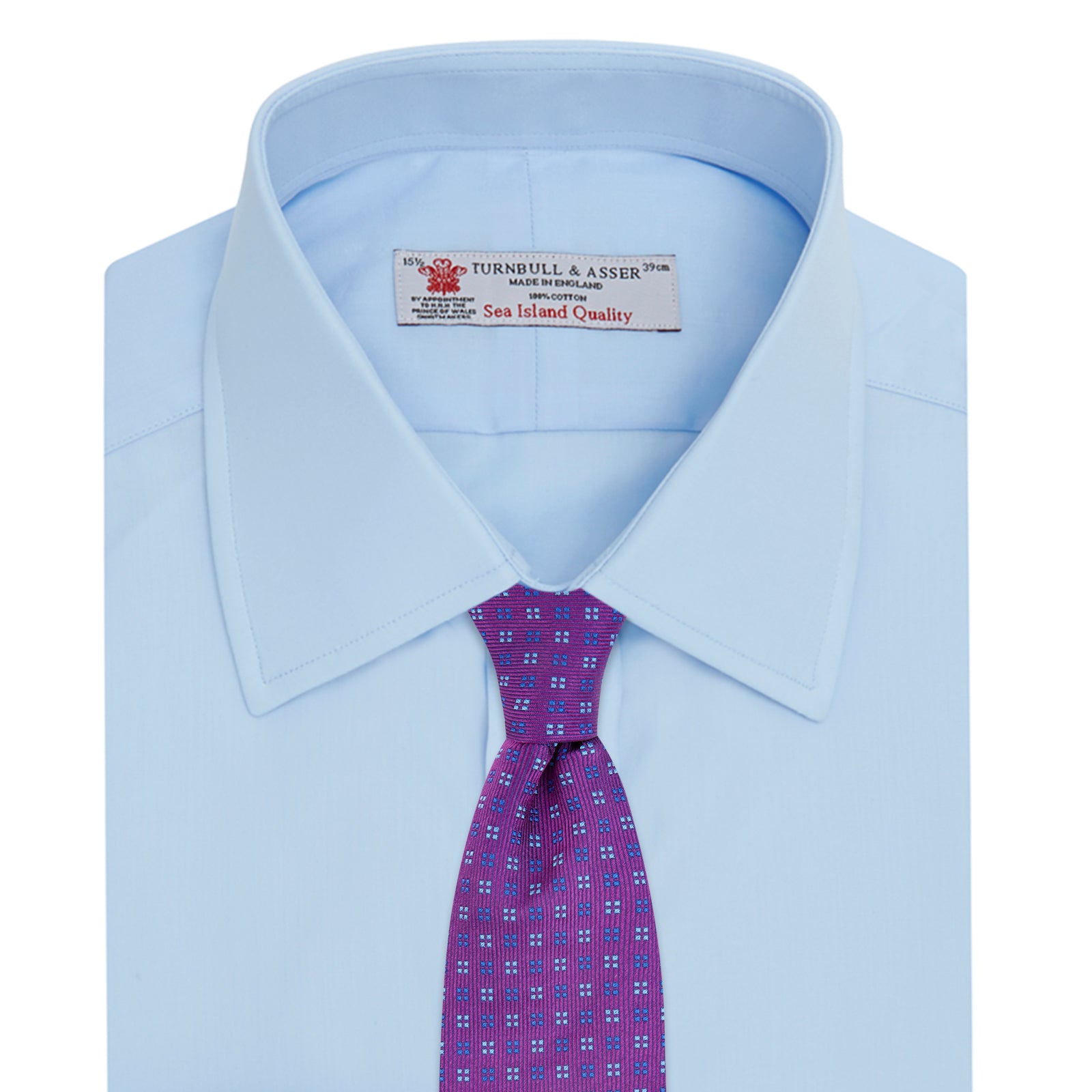View 4 of product The Turnbull & Asser Light Blue Sea Island Quality Cotton Shirt features a T&A collar, double cuffs, white buttons, and a quality label inside the collar. Displayed on a plain white background.