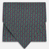 View 1 of product The Forest Green and Red Weave Patterned Silk Cravat by Turnbull & Asser features an elegant geometric design in rich hues, folded to a pointed end for a classic, British-inspired look.