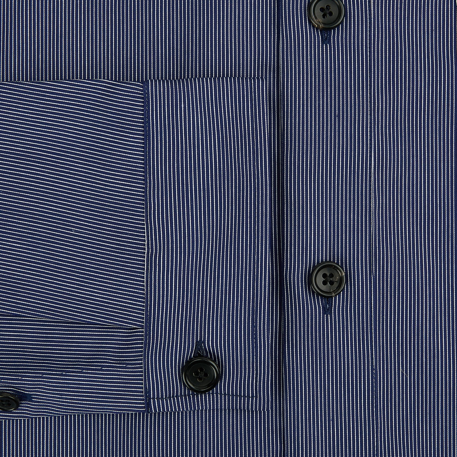 View 4 of product Turnbull & Asser’s Navy Stripe Highbury Overshirt with long sleeves, button-up front, black buttons, collar, and a left chest pocket is shown laid flat on a white background.