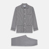 View 1 of product The Turnbull & Asser Black Candy Stripe Cotton Hyde Pyjama Set for men features soft cotton striped pajamas with a long-sleeve, button-up shirt detailed with black piping and three pockets, plus matching pants, both laid flat on a white background.