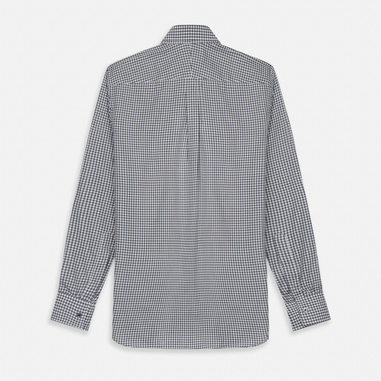 View 5 of product A person with a shaved head models the Turnbull & Asser Grey Check Weekend Fit Flannel Shirt with a Derby collar and 1-button cuffs, sleeves rolled up, paired with dark trousers against a plain background, gazing directly at the camera.