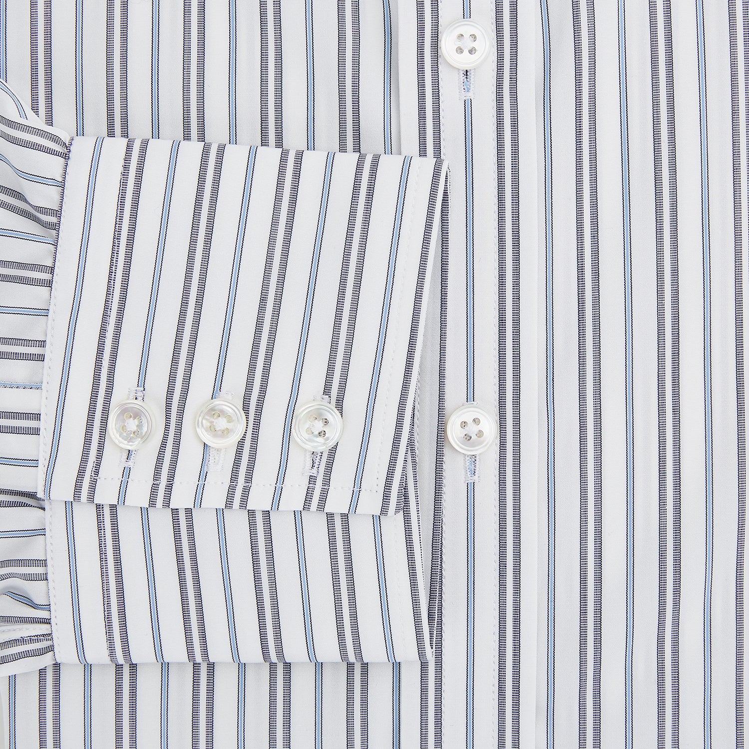 View 4 of product The Turnbull & Asser Navy Multi Stripe Mayfair Shirt features a T&A collar and premium Italian cotton, with vertical blue and white stripes. It is shown neatly laid flat on a white background.