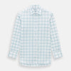 View 1 of product The Turnbull & Asser Sage Grid Check Mayfair Shirt is a white, long-sleeve shirt made from Italian cotton with a light blue and sage grid pattern, shown neatly laid flat on a plain, light background.