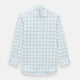The Turnbull & Asser Sage Grid Check Mayfair Shirt is a white, long-sleeve shirt made from Italian cotton with a light blue and sage grid pattern, shown neatly laid flat on a plain, light background.