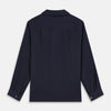 View 5 of product The Turnbull & Asser Navy Hemp Holiday Fit Winnington Shirt is a long-sleeve, button-up shirt with a single chest pocket, shown laid flat on a white background.
