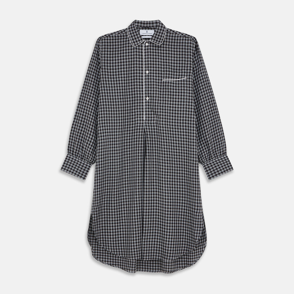 The Turnbull & Asser Black Multi Check Cotton Blend Sussex Nightshirt features a long sleeve, knee-length design with front buttons, a pointed collar, and chest pocket—ideal for those who love luxury sleepwear.