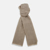 View 1 of product A Turnbull & Asser Beige and White Striped Cashmere Scarf, featuring a subtle pattern and fringed edge, is neatly folded and knotted against a plain white background.
