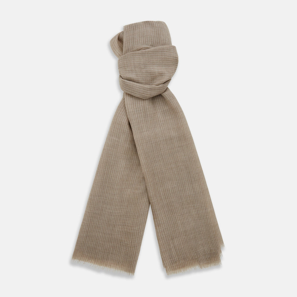 A Turnbull & Asser Beige and White Striped Cashmere Scarf, featuring a subtle pattern and fringed edge, is neatly folded and knotted against a plain white background.