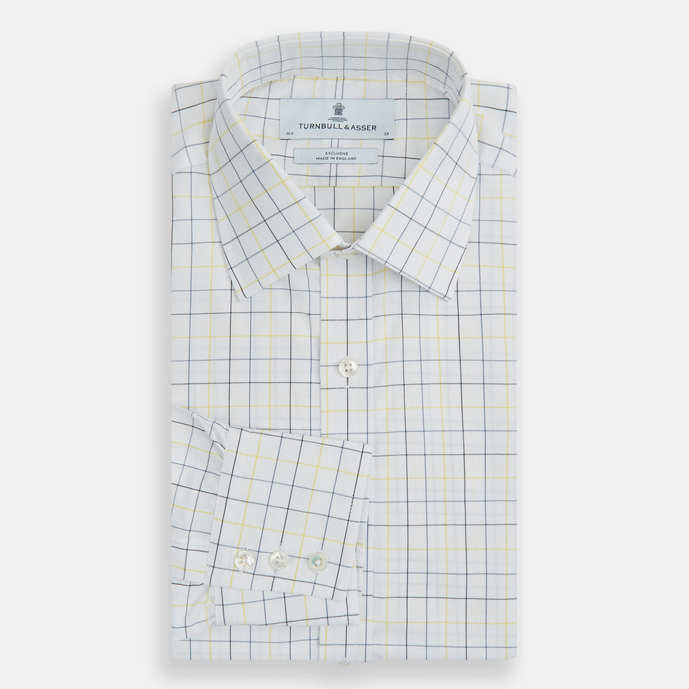 The Turnbull & Asser Yellow and Blue Grid Check Mayfair Shirt features a long-sleeve button-up design with a yellow and blue grid pattern, shown against a plain white background.