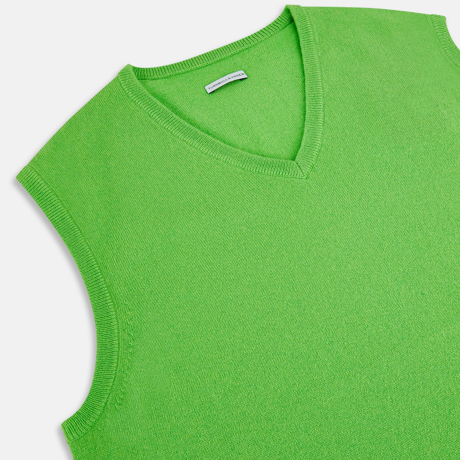 View 2 of product The Turnbull & Asser Bright Green V-neck Cashmere Vest is a sleeveless jumper with ribbed edges, shown on a plain white background.