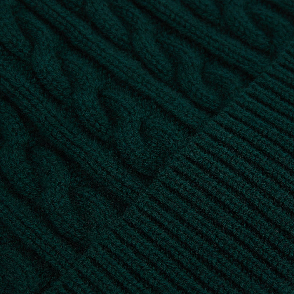 The Forest Green Cable Knit Cashmere Beanie by Turnbull & Asser features a chunky texture and thick ribbed fold-over cuff, shown on a plain white background.