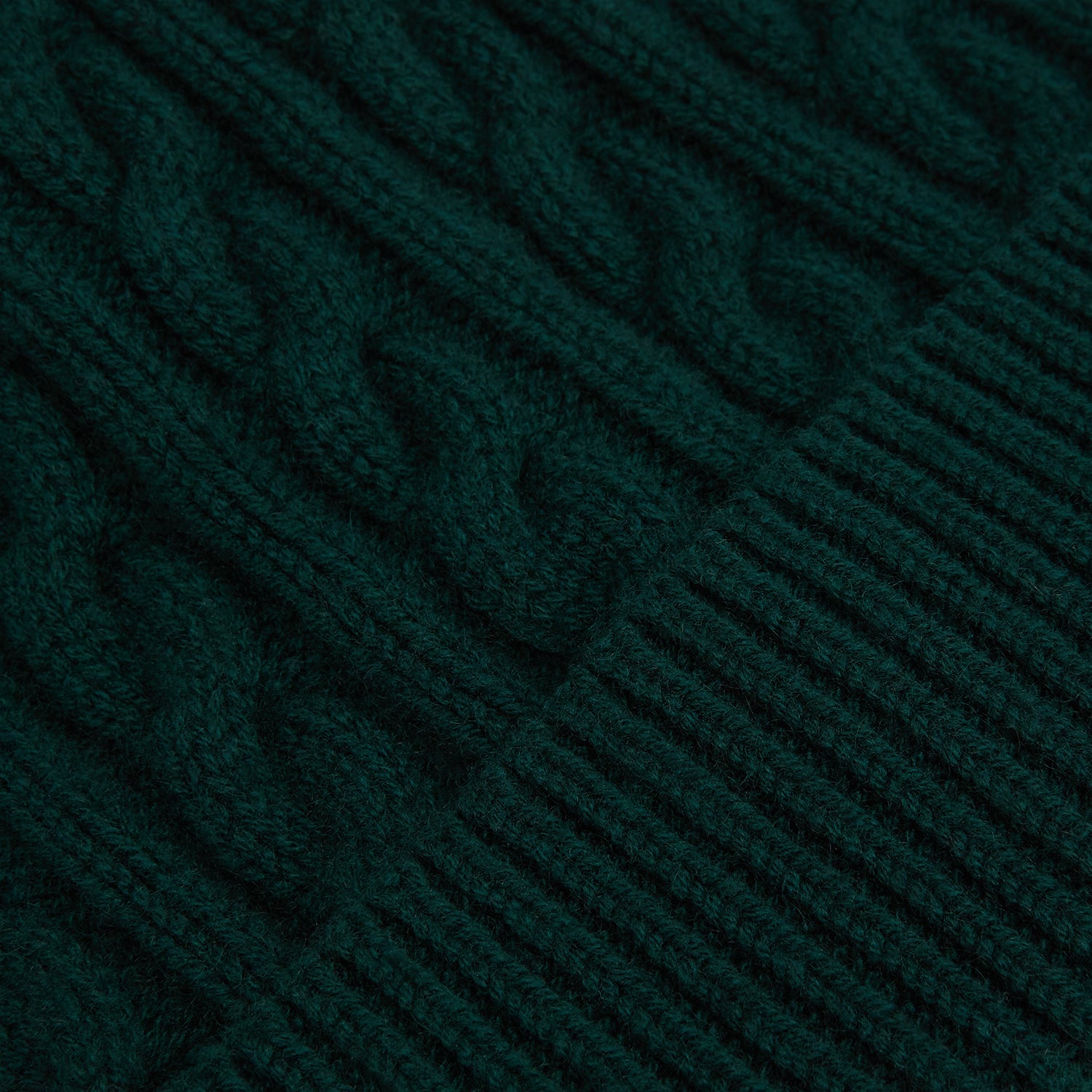 View 2 of product The Forest Green Cable Knit Cashmere Beanie by Turnbull & Asser features a chunky texture and thick ribbed fold-over cuff, shown on a plain white background.