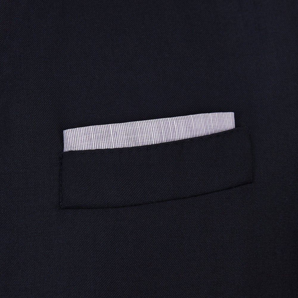 The Lilac Cotton-Blend Handkerchief by Turnbull & Asser is neatly folded with a corner flipped over, exposing the hand-rolled edges, and displayed against a white background.