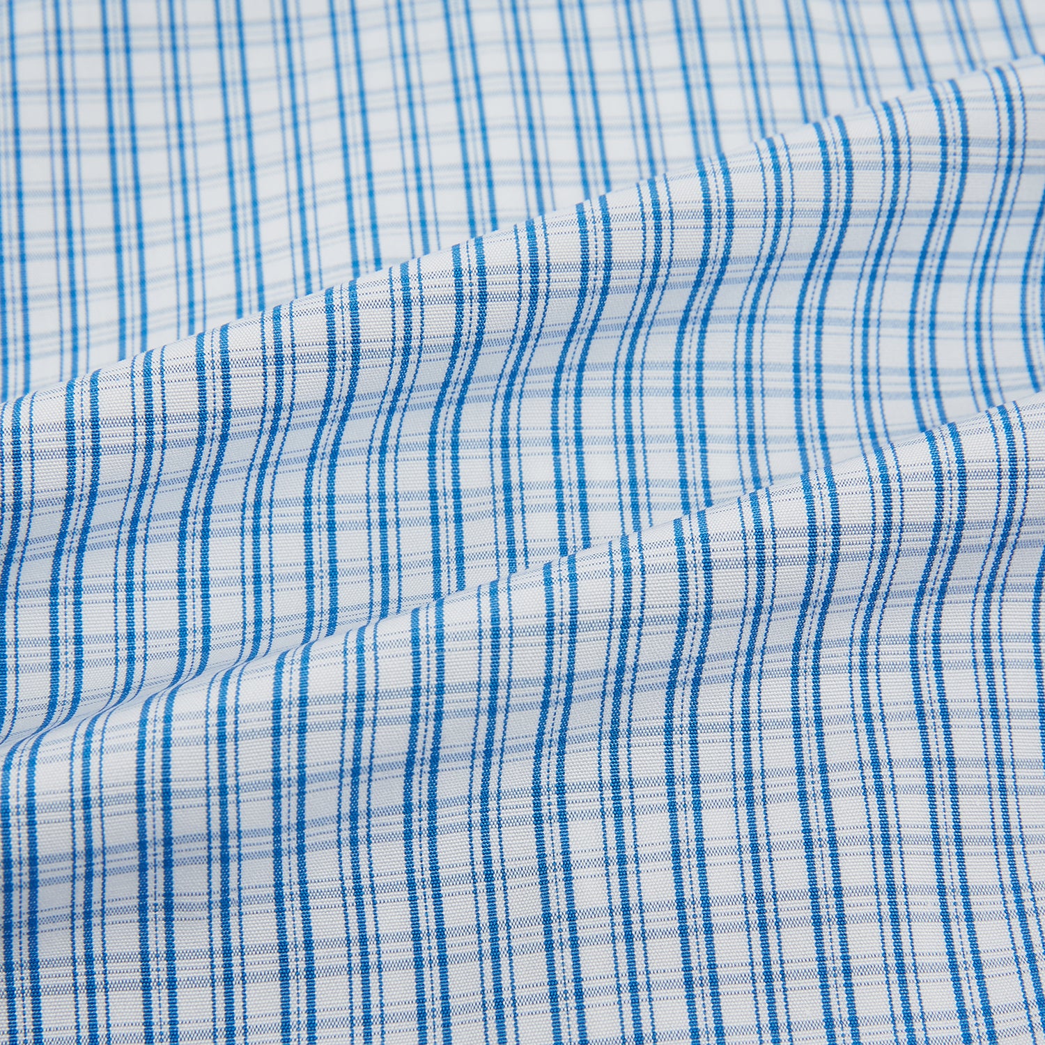 View 6 of product The Sky Blue Micro Graph Check Mayfair Shirt by Turnbull & Asser features a classic T&A collar, button-down front, and buttoned cuffs, shown laid flat on a white background.