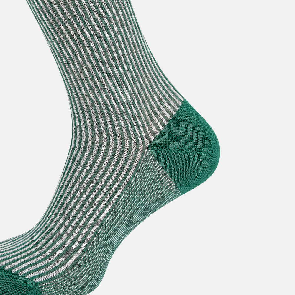 Turnbull & Asser Melon Green/White Thin Striped Long Sock features melon green and white vertical stripes with a solid green toe, heel, and cuff, shown singly against a plain light background.