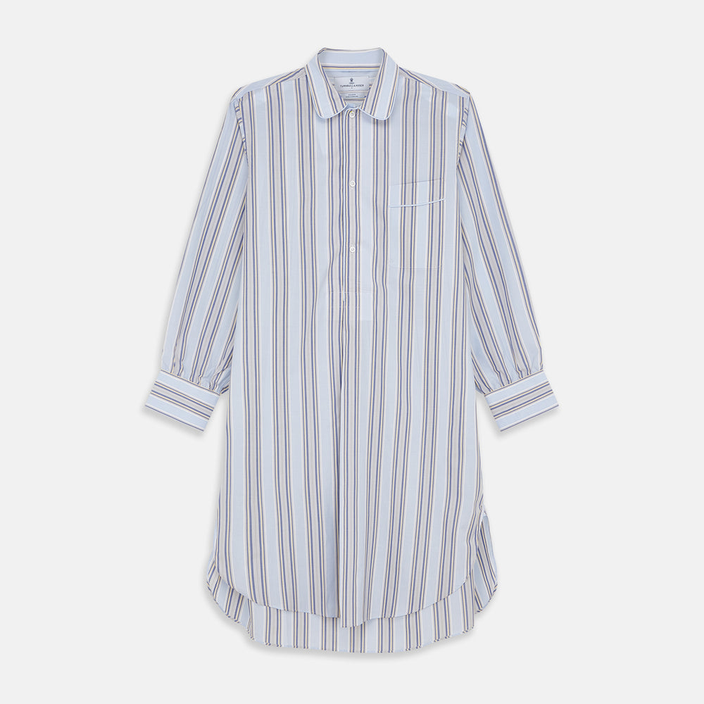 The Pale Blue and Yellow Multi Stripe Cotton Sussex Nightshirt by Turnbull & Asser features long sleeves, a knee-length cut, a collar, button-down front, chest pocket, and rounded hem.