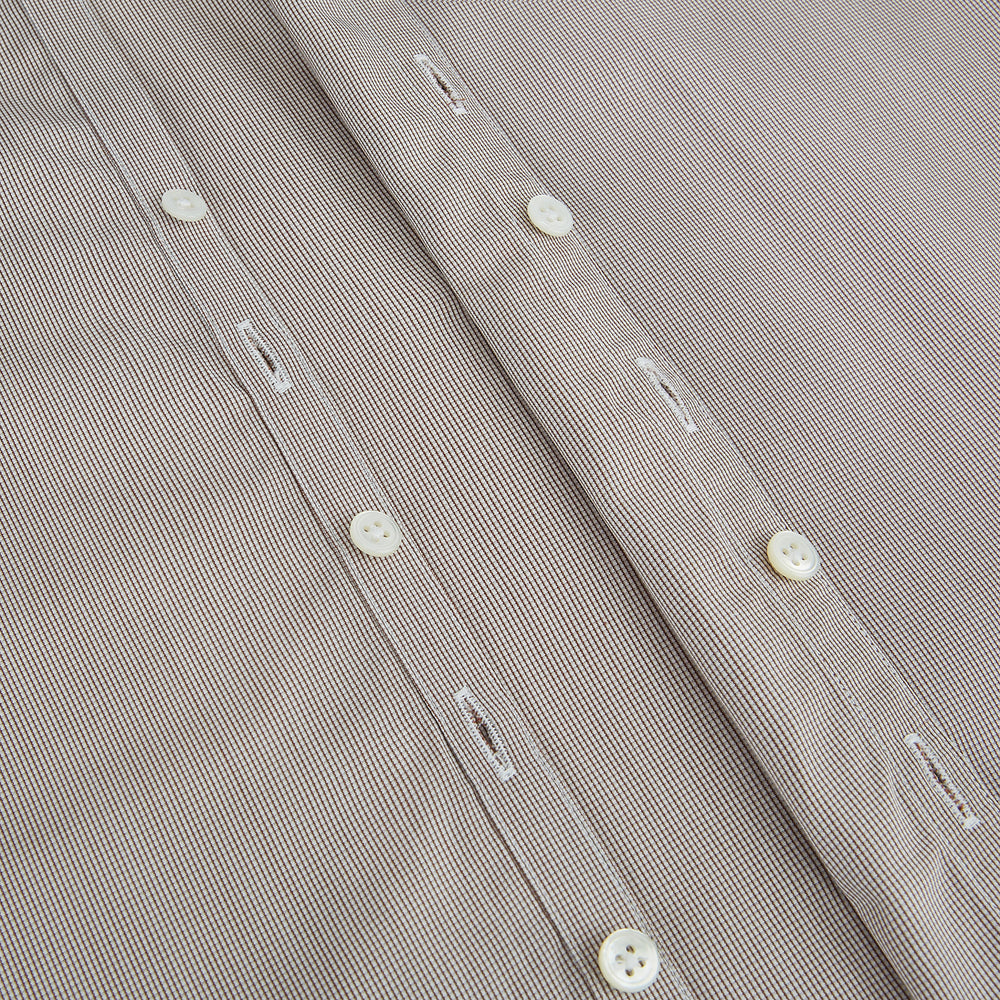 The Turnbull & Asser Brown Micro Graph Check Westminster shirt features long sleeves, a pointed collar, and buttoned cuffs—showcasing British craftsmanship and displayed flat on a white background.