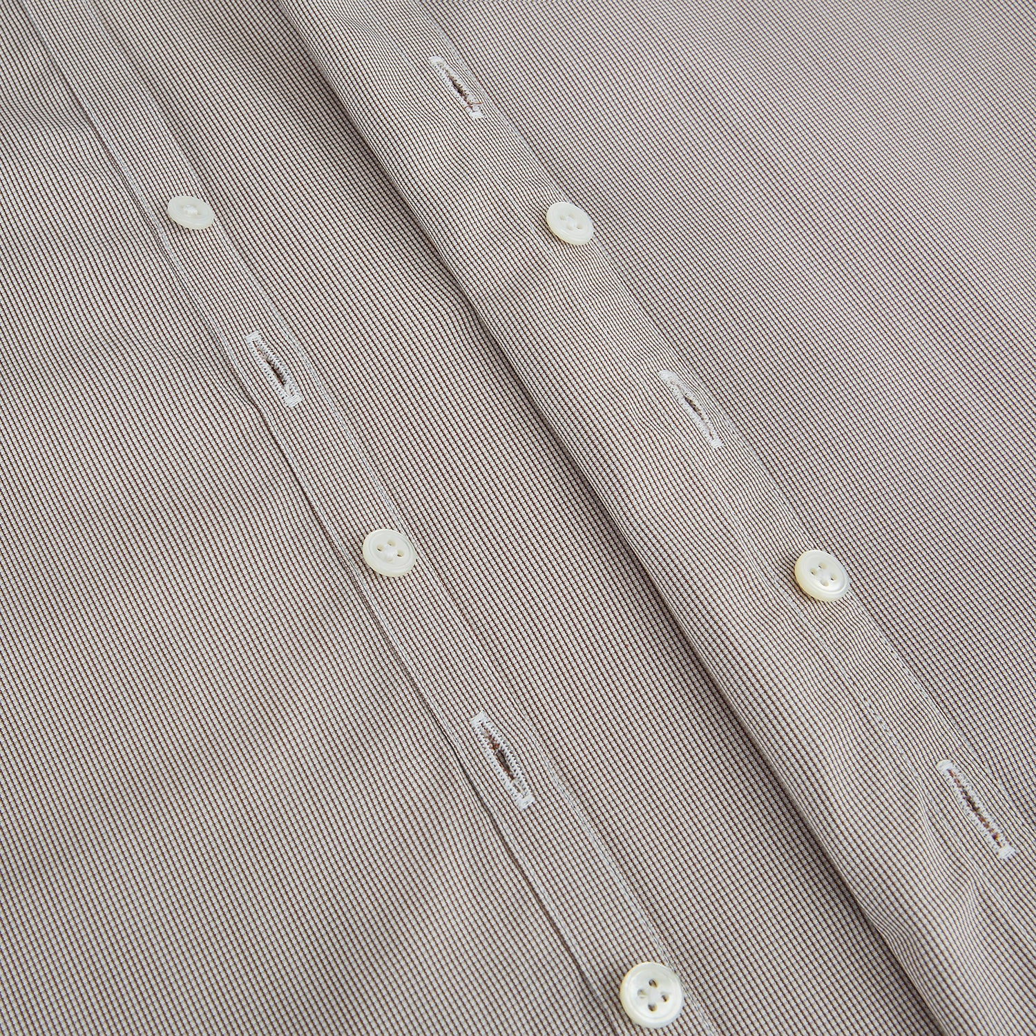 View 7 of product The Turnbull & Asser Brown Micro Graph Check Westminster shirt features long sleeves, a pointed collar, and buttoned cuffs—showcasing British craftsmanship and displayed flat on a white background.