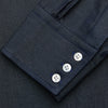 View 3 of product The Turnbull & Asser Navy Weekend Fit Larkin Shirt features a Dorset collar, long sleeves with 3-button cuffs, two chest pockets, and white snaps, shown laid flat against a white background.