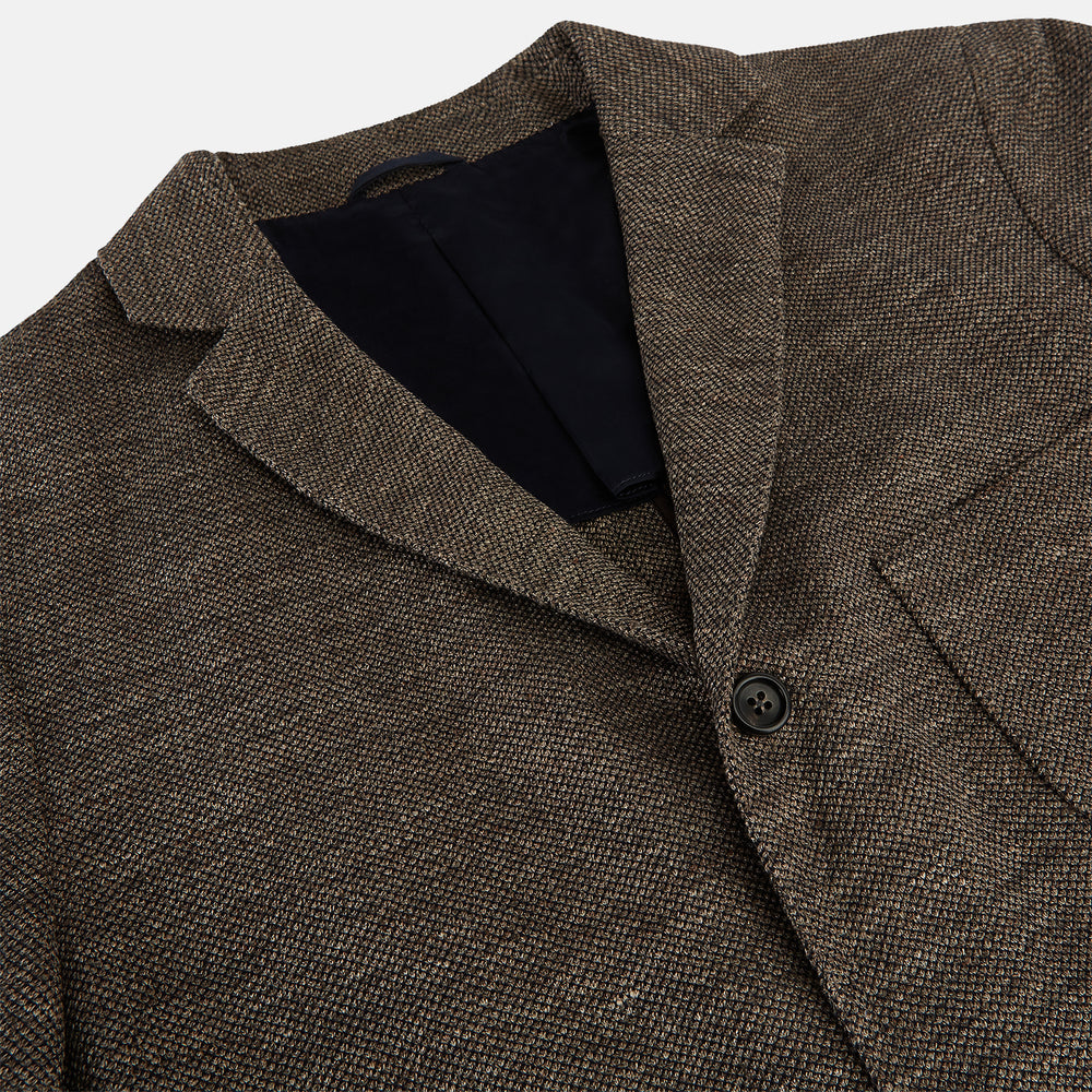 The Turnbull & Asser Pine Cone Linen Blend Cambridge blazer features a textured brown finish, notched lapel, two buttons, patch and chest pockets—showcasing classic British tailoring against a plain white background.