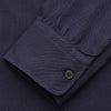 View 3 of product The Turnbull & Asser Navy Military Weekend Fit Shirt features a stand collar, black buttons, dual chest flap pockets, and 1-button cuffs in Italian cotton-wool, shown laid flat on a white background.