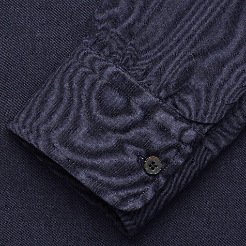 The Turnbull & Asser Navy Military Weekend Fit Shirt features a stand collar, black buttons, dual chest flap pockets, and 1-button cuffs in Italian cotton-wool, shown laid flat on a white background.