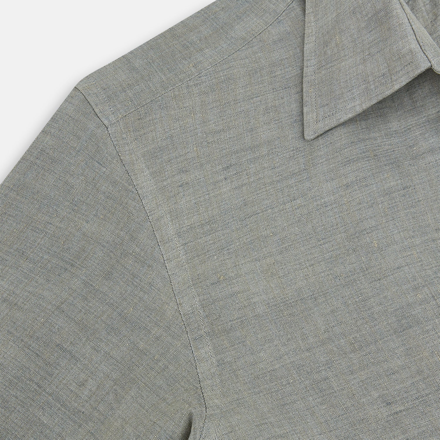 View 6 of product The Flint Grey Linen Westminster Shirt by Turnbull & Asser features long sleeves, a pointed Westminster collar, white buttons, and fine British craftsmanship, shown on a plain white background.
