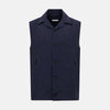 View 1 of product Turnbull & Asser Navy Collared Linen Waistcoat features a tailored fit, sleeveless design, button-up front, left chest pocket, and two zippered side pockets, shown against a plain white background.