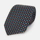The Turnbull & Asser Navy and Orange Geometric Motif Silk Tie features a dark blue base with small orange, white, and light blue geometric patterns—a refined statement of British craftsmanship.