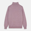 View 3 of product The Turnbull & Asser Lilac Heather Aubrey Cashmere Roll Neck Jumper features ribbed cuffs and hem—ideal for pairing with your favorite tailored trousers.