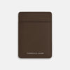 View 1 of product The Dark Chocolate Two-slot Card Case by Turnbull & Asser features slim Italian leather, subtle stitching, and white embossed branding at the bottom center—a refined minimalist accessory on a plain white background.