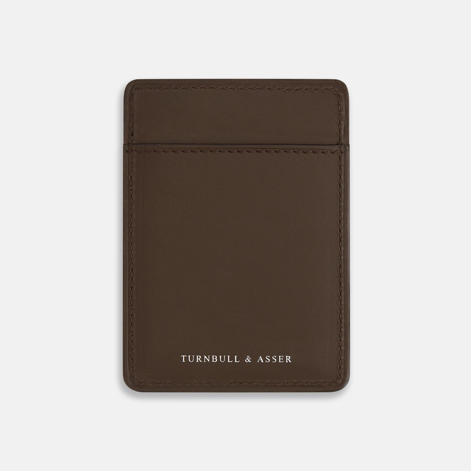 View 1 of product The Dark Chocolate Two-slot Card Case by Turnbull & Asser features slim Italian leather, subtle stitching, and white embossed branding at the bottom center—a refined minimalist accessory on a plain white background.