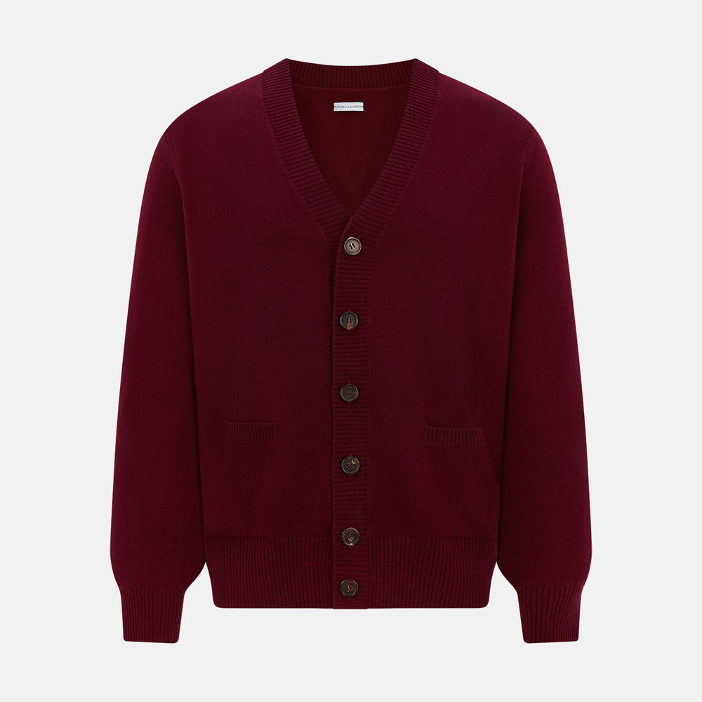 The Turnbull & Asser Burgundy Cashmere Cardigan features a V-neck, ribbed cuffs and hem, two front pockets, and a classic button-up design, shown on a plain white background.