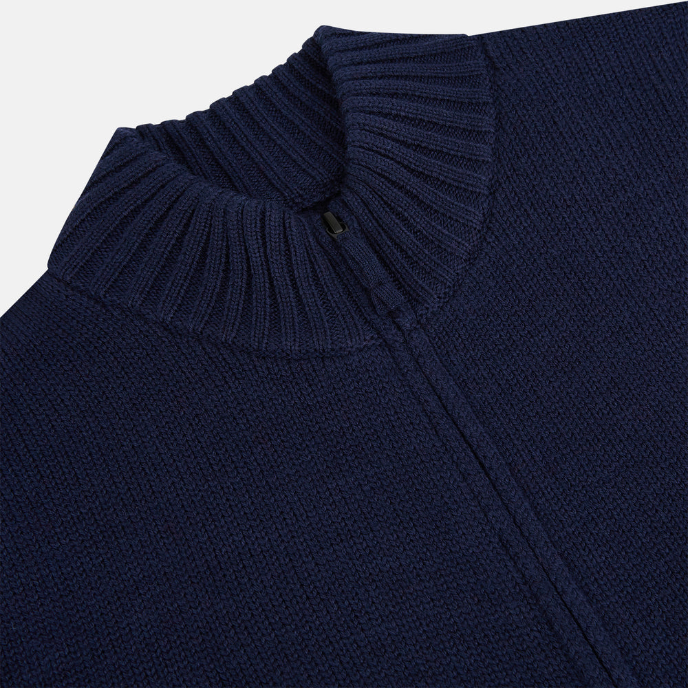The Turnbull & Asser Navy High Neck Merino Zipped Cardigan is a long-sleeve knit with ribbed mock neck, cuffs, and hem, shown on a plain white background.