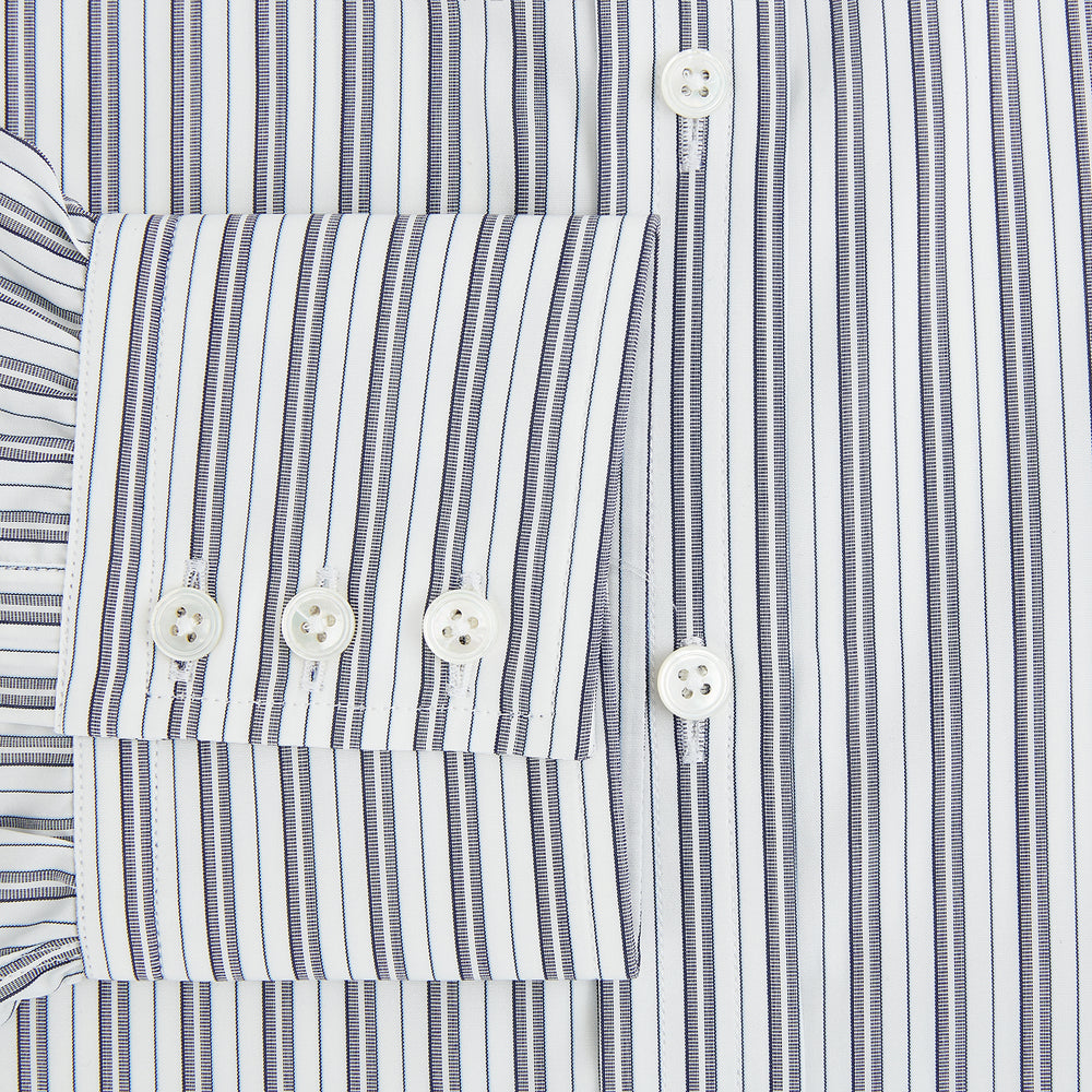 The Turnbull & Asser Navy Multi Stripe Mayfair Shirt, a pure cotton button-up with long sleeves and a collar, features thin vertical blue and white stripes and is displayed flat on a white background.