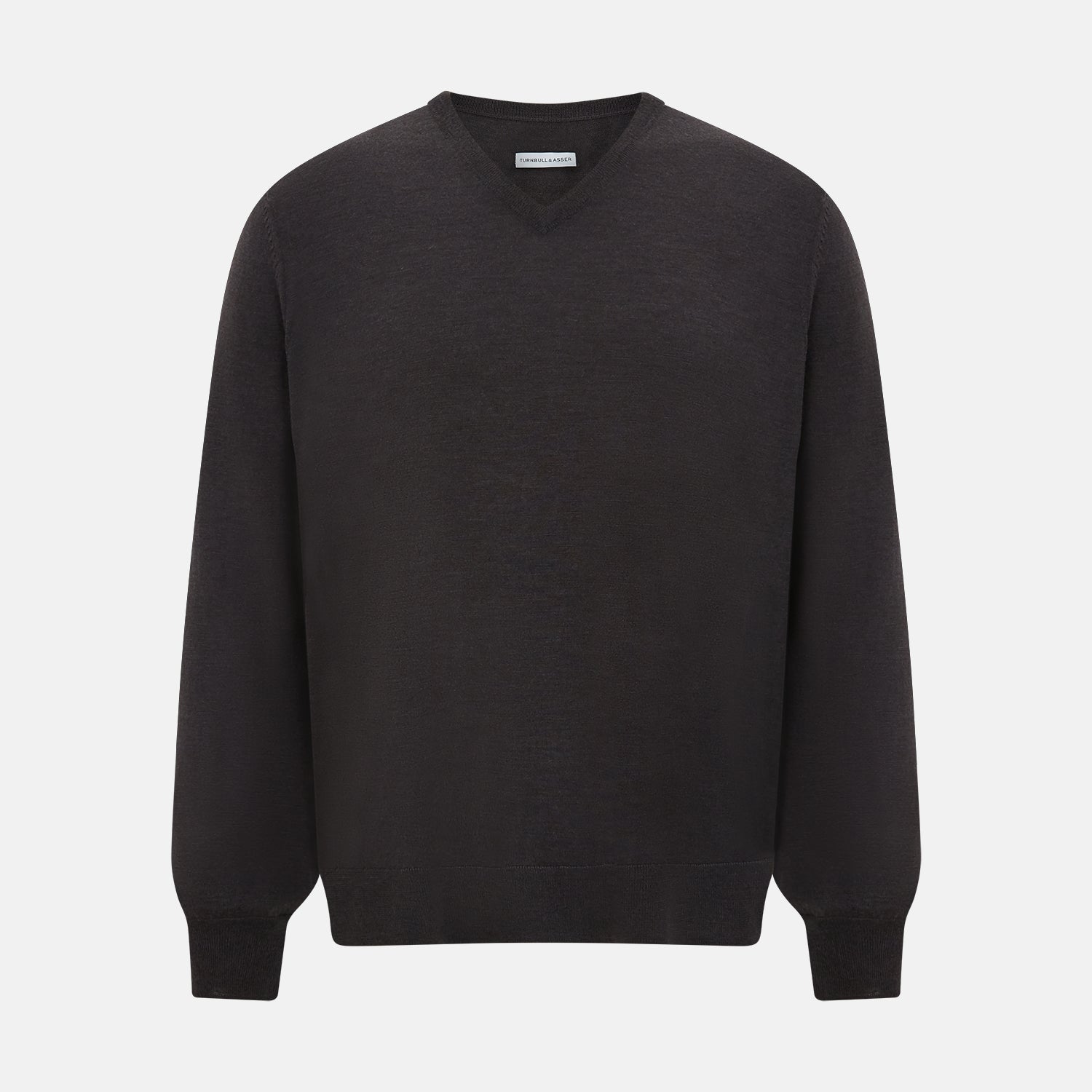 View 1 of product The Turnbull & Asser Charcoal Grey Merino V Neck Jumper is a classic long-sleeve knit with ribbed cuffs and hem, featured in our knitwear collection and shown against a white background.