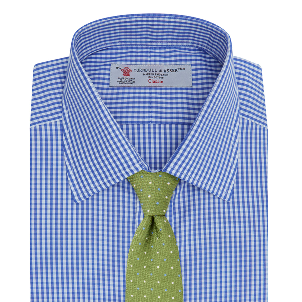 The Turnbull & Asser Mid-Blue Gingham Check Shirt features a T&A collar and 3-button cuffs, crafted from cotton and displayed folded on a plain white background.