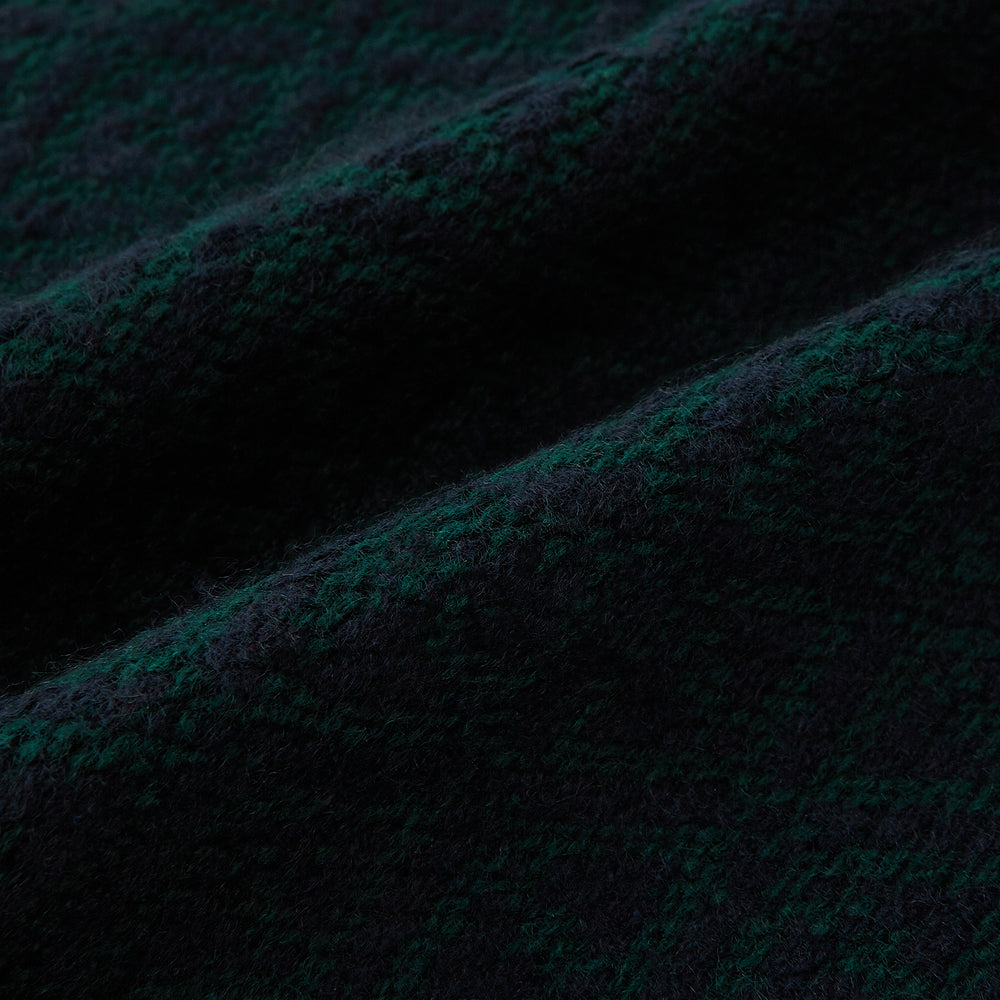 The Turnbull & Asser Navy Blue and Forest Green Diamond-Patterned Cashmere Knitted Scarf features a subtle textured design, shown loosely draped with ends hanging down—an essential, stylish addition to any cool-weather wardrobe.
