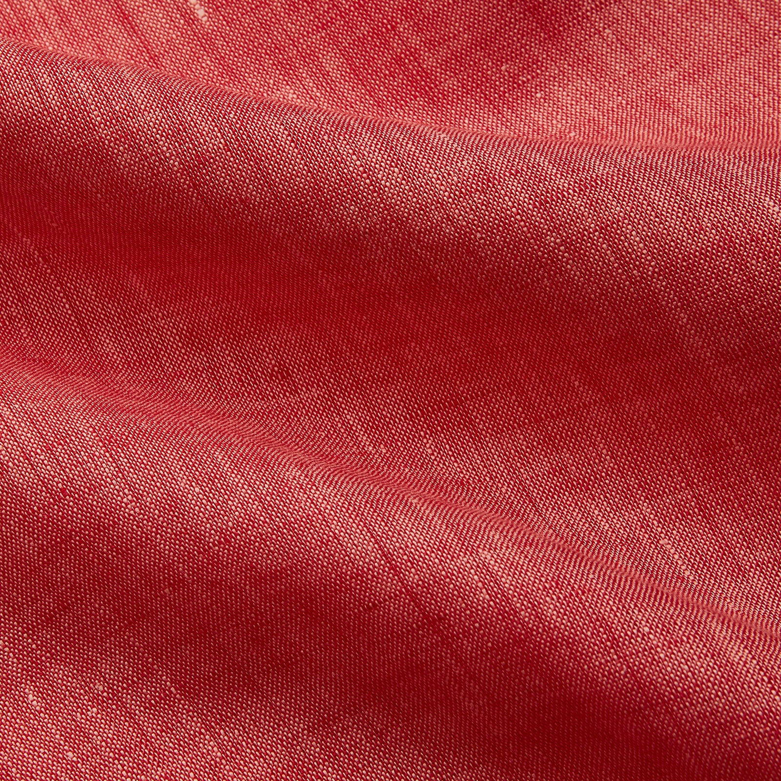 View 4 of product The Turnbull & Asser Pink Linen Weekend Fit Hayne Shirt is a casual, long-sleeve button-down with a subtle texture and white buttons, neatly laid flat on a white background.