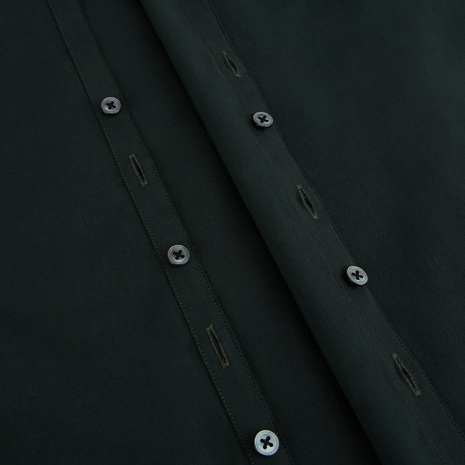 View 7 of product The FOREST GREEN WINDSOR SHIRT by Turnbull & Asser features long sleeves, a Windsor collar, and buttoned cuffs, reflecting British craftsmanship. Displayed on a plain white background.